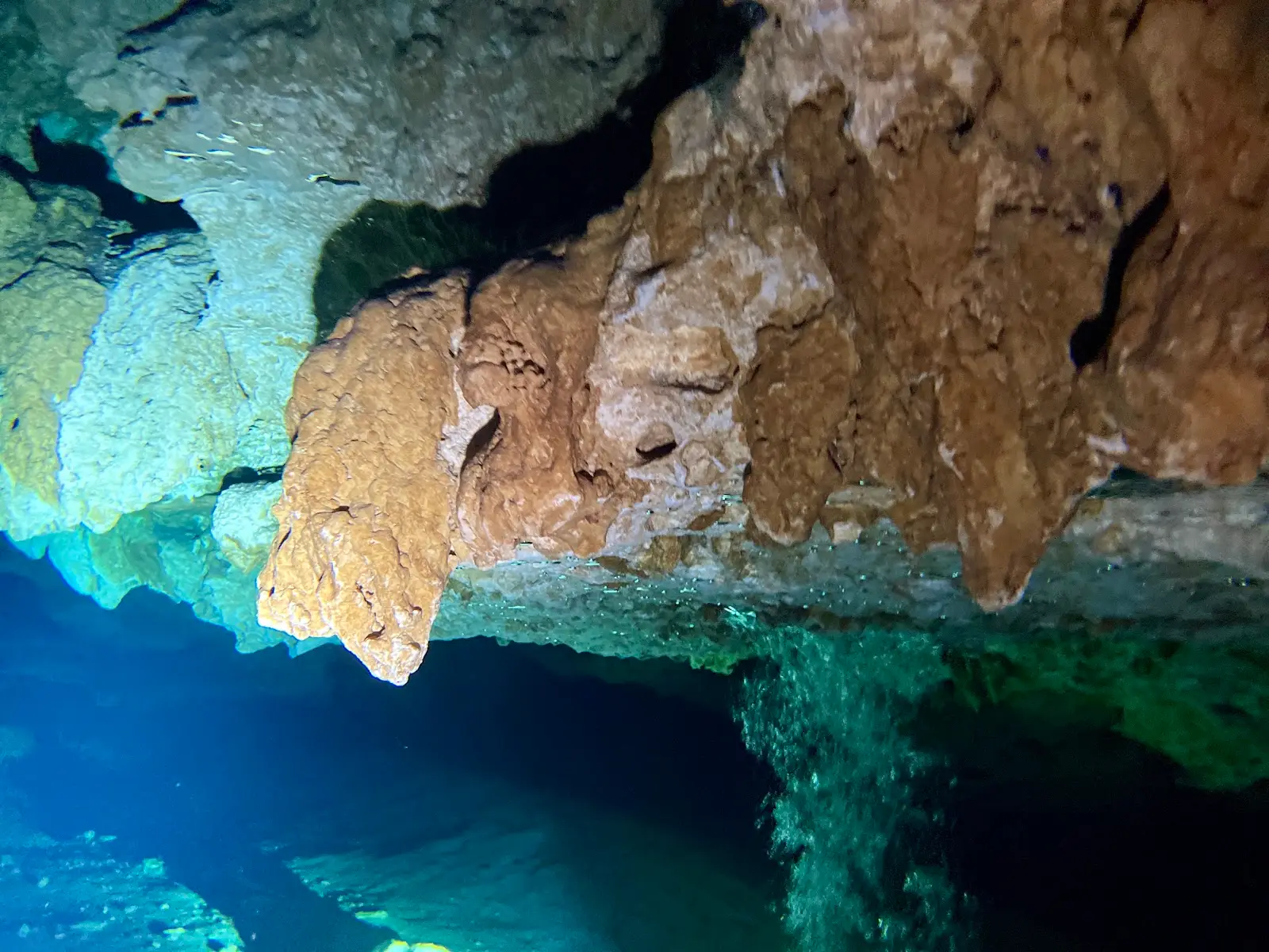 10 Most Beautiful Cenotes Near Playa del Carmen: A Diver’s Guide 2 Rock formations and blue water on a dive in Cenote Chac Mool