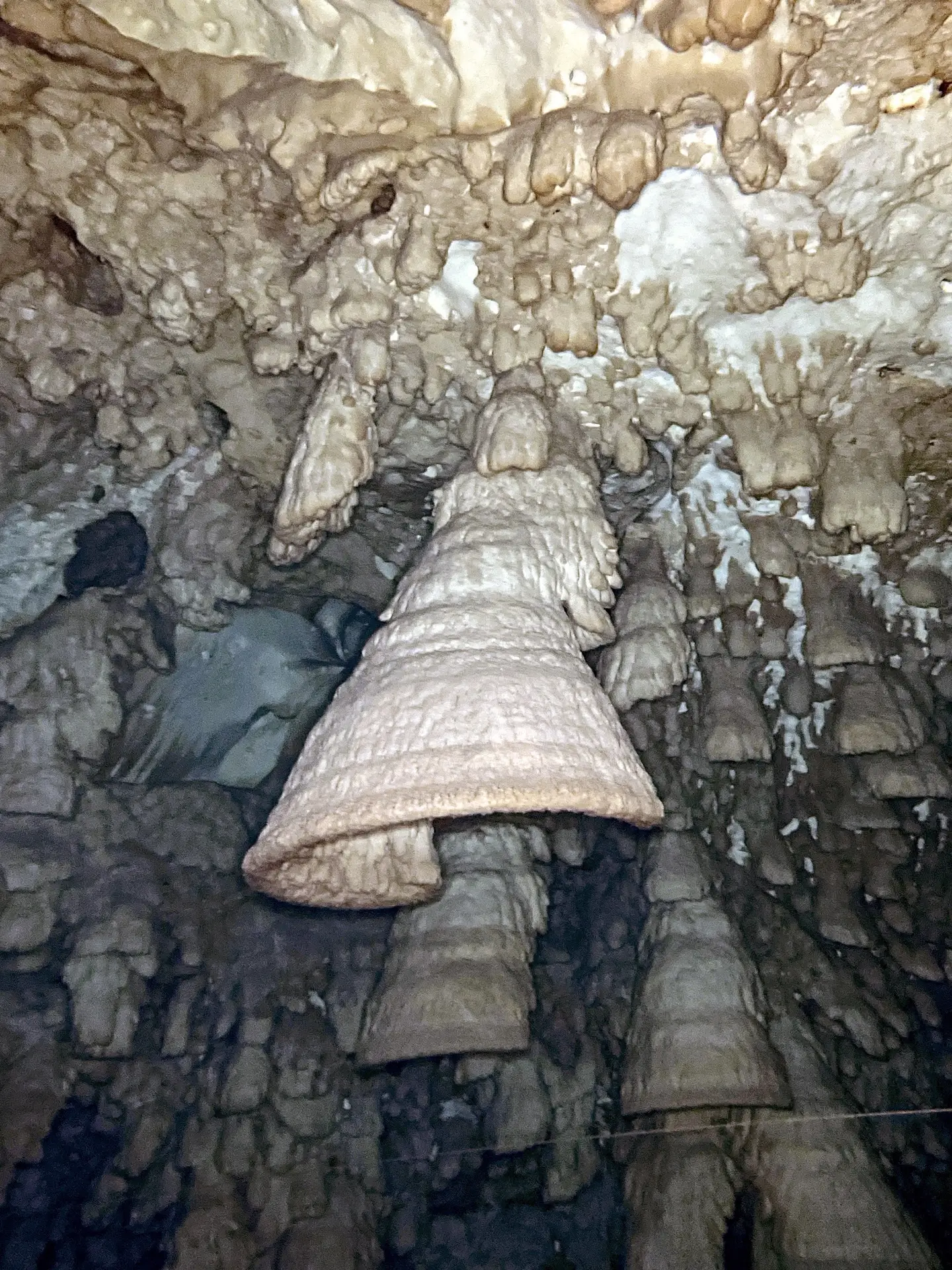How to Become a Cave Diver in Mexico: From Cavern to Full Cave 3 Diver light above the white hydrogen sulfide layer beneath the bells in Cenote Zapote